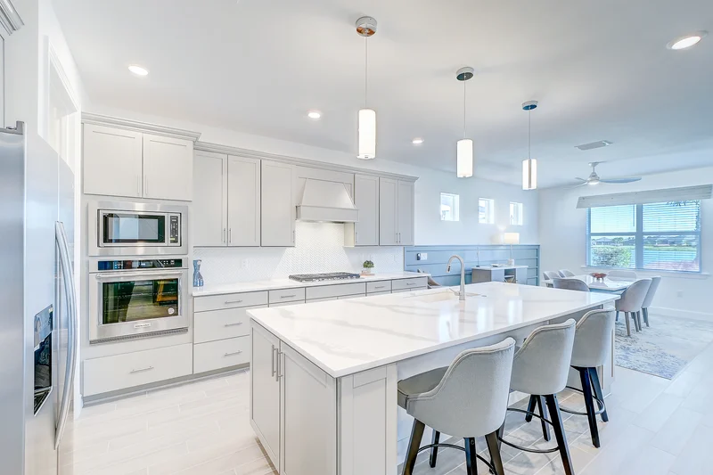 Bright kitchen with a large island and white cabinetry