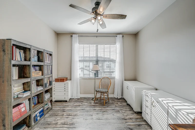 Light-filled home office with built-in shelving